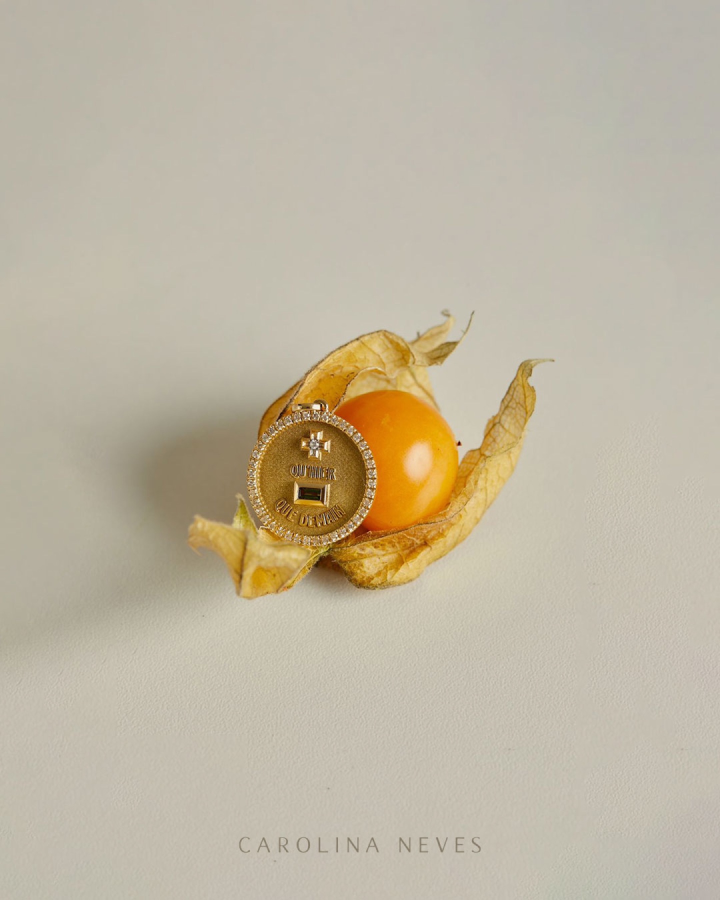 Carolina Neves pendant photographed with a physalis fruit