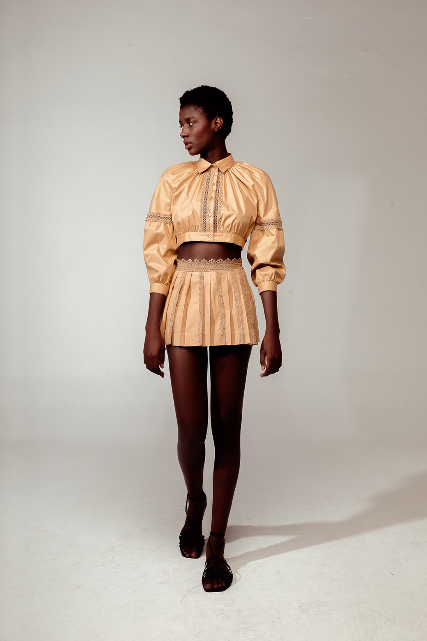 La Gea model in a sand-toned two-piece look